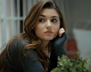 Hande Erçel in a Contemplative Close-Up with Soft Indoor Lighting HD wallpaper