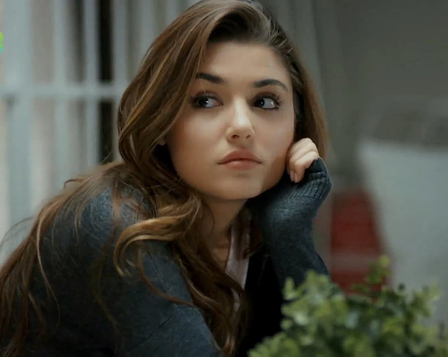 Hande Erçel in a Contemplative Close-Up with Soft Indoor Lighting HD wallpaper