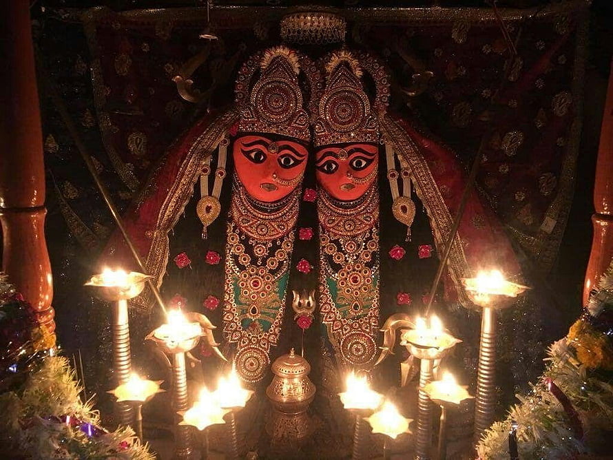 Sri Chamunda Mataji Temple Idol with Oil Lamps and Ornate Jewelry HD wallpaper