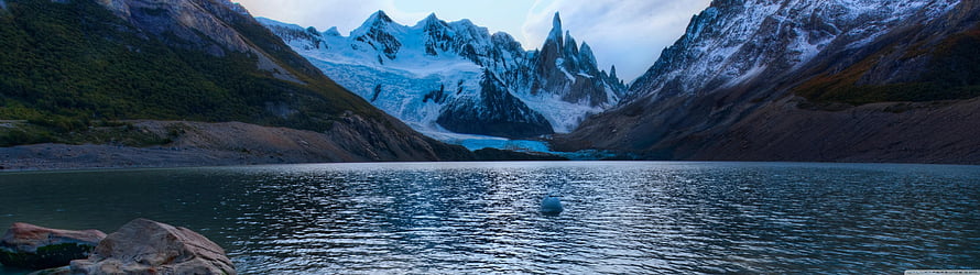 Cerro Torre and Torre Grande peaks reflected in Lago Torre with glacier icebergs HD wallpaper