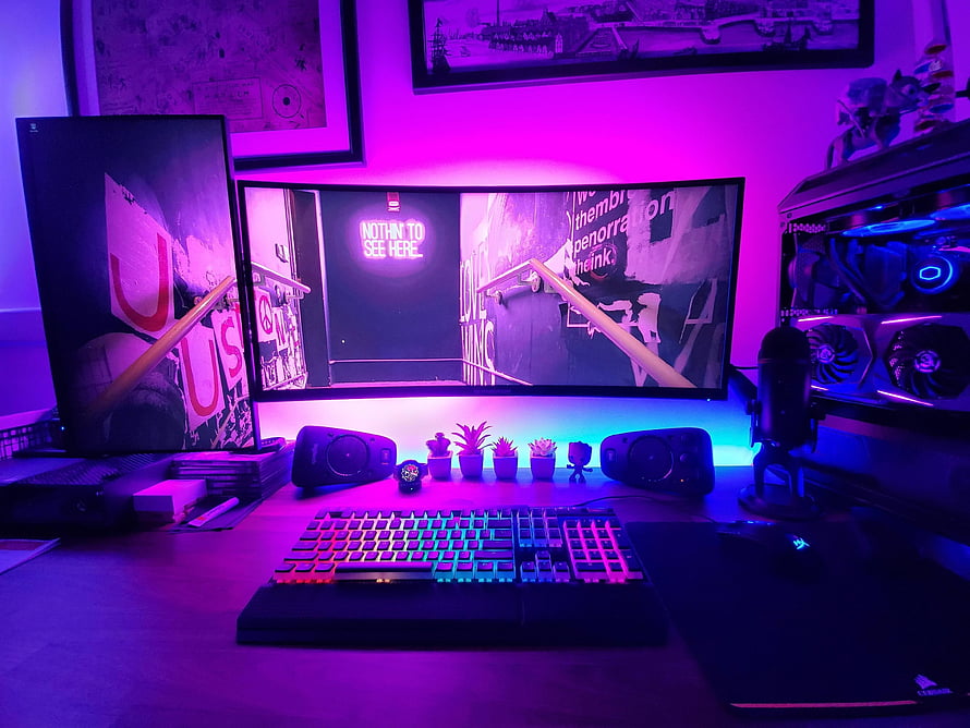 Vibrant RGB Gaming Setup with Curved Monitor and Mechanical Keyboard HD wallpaper