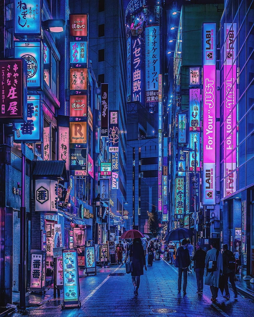 Vibrant Neon Lights of Shinjuku Street at Night with Pedestrians HD phone wallpaper
