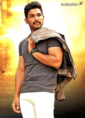 Allu Arjun stylish portrait wearing grey t-shirt and white pants with jacket draped over shoulder HD phone wallpaper