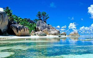 Tropical Beach with Giant Granite Boulders and Crystal Clear Turquoise Water HD wallpaper