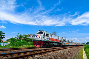 Kereta Api Indonesia CC 206 Locomotive Pulling Passenger Train on Sunny Day HD wallpaper