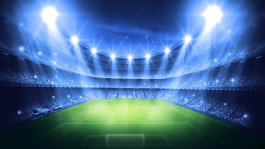 Illuminated Soccer Stadium at Night with Bright Floodlights and Green Pitch HD wallpaper