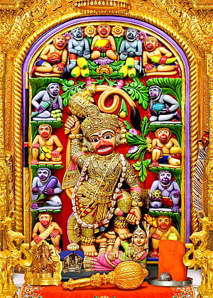 Vibrant Hanuman Statue Surrounded by Monkeys in Golden Temple Shrine, Welcome to Kashtbhanjandev Temple, sarangpur HD phone wallpaper