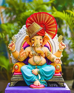 Colorful Ganesha Statue Wearing Red Crown and Blue Dhoti Sitting on Throne HD phone wallpaper
