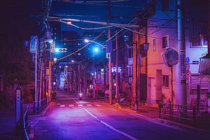 Neon-lit Japanese street at night with purple and blue cinematic lighting HD wallpaper