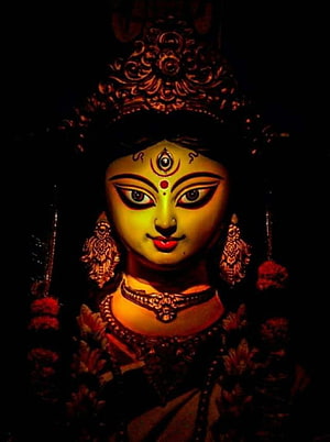 Portrait of Hindu Goddess Kali with Third Eye and Ornate Jewelry in Dark Atmosphere HD phone wallpaper
