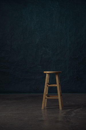 Minimalist Wooden Stool on Dark Textured Background HD phone wallpaper
