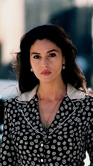 Monica Bellucci in Malena wearing a black and white patterned blouse with a cross necklace HD phone wallpaper