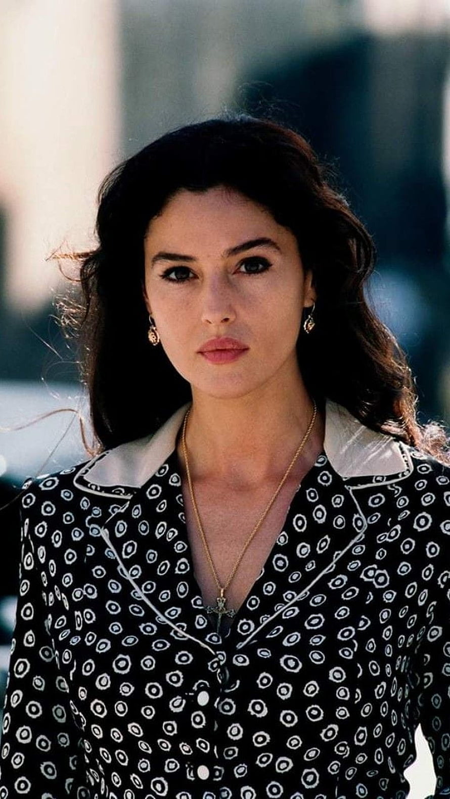 Monica Bellucci in Malena wearing a black and white patterned blouse with a cross necklace HD phone wallpaper