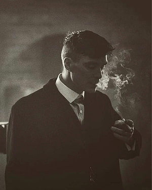 Tommy Shelby from Peaky Blinders Smoking in a Dark Moody Portrait HD phone wallpaper