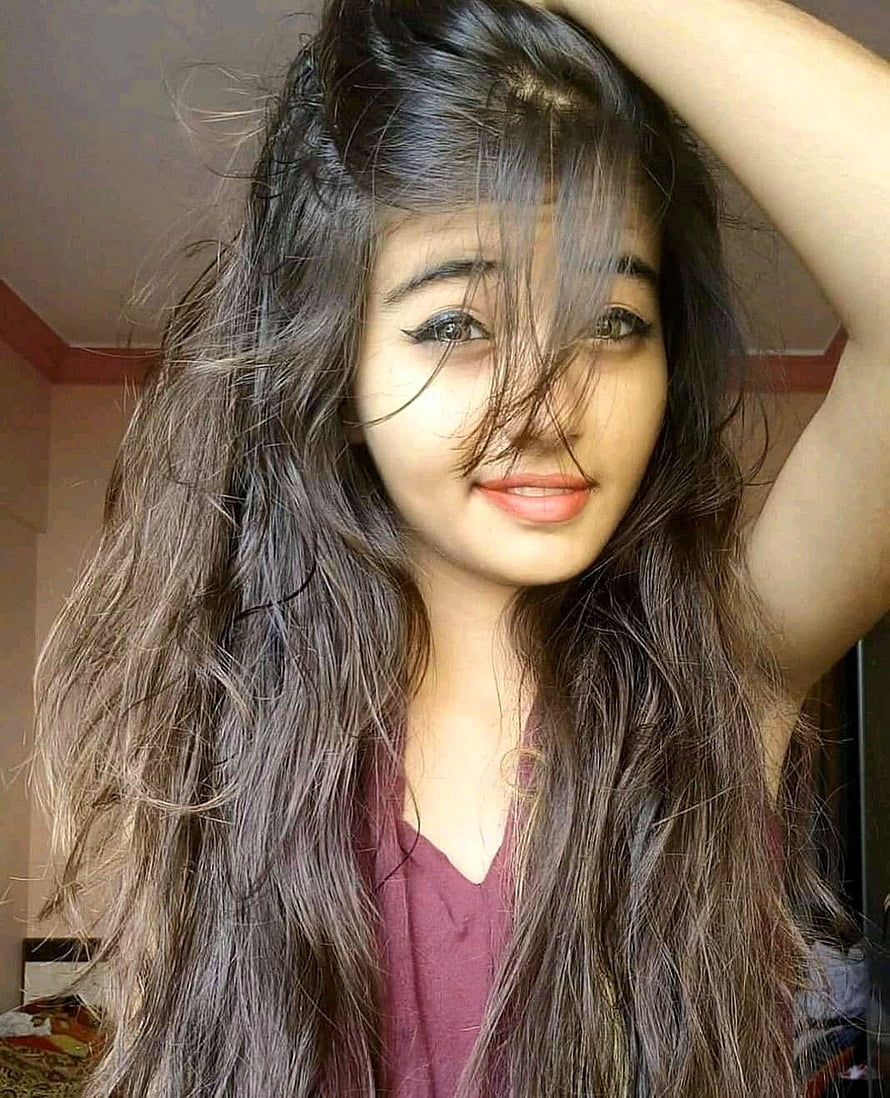Portrait of a young woman with long wavy dark hair and a maroon top, Latest Dp For Girls Pics, cute girl dp HD phone wallpaper