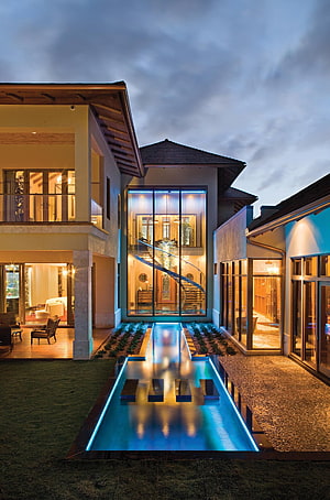 Modern Luxury Villa with Illuminated Reflecting Pool and Glass Atrium at Night HD phone wallpaper