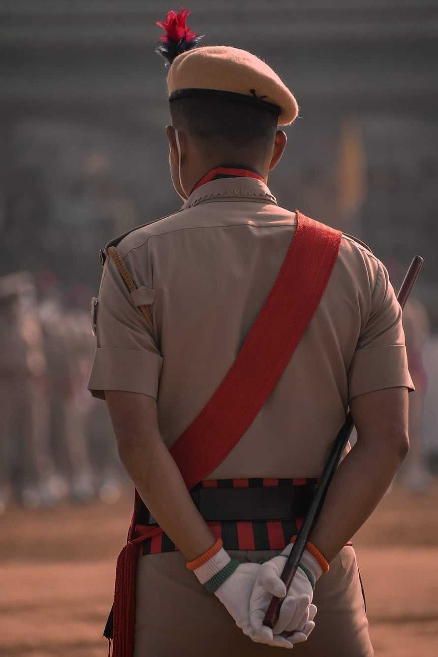 Indian Police Officer in Ceremonial Uniform with Red Sam Browne Strap and Beret HD phone wallpaper