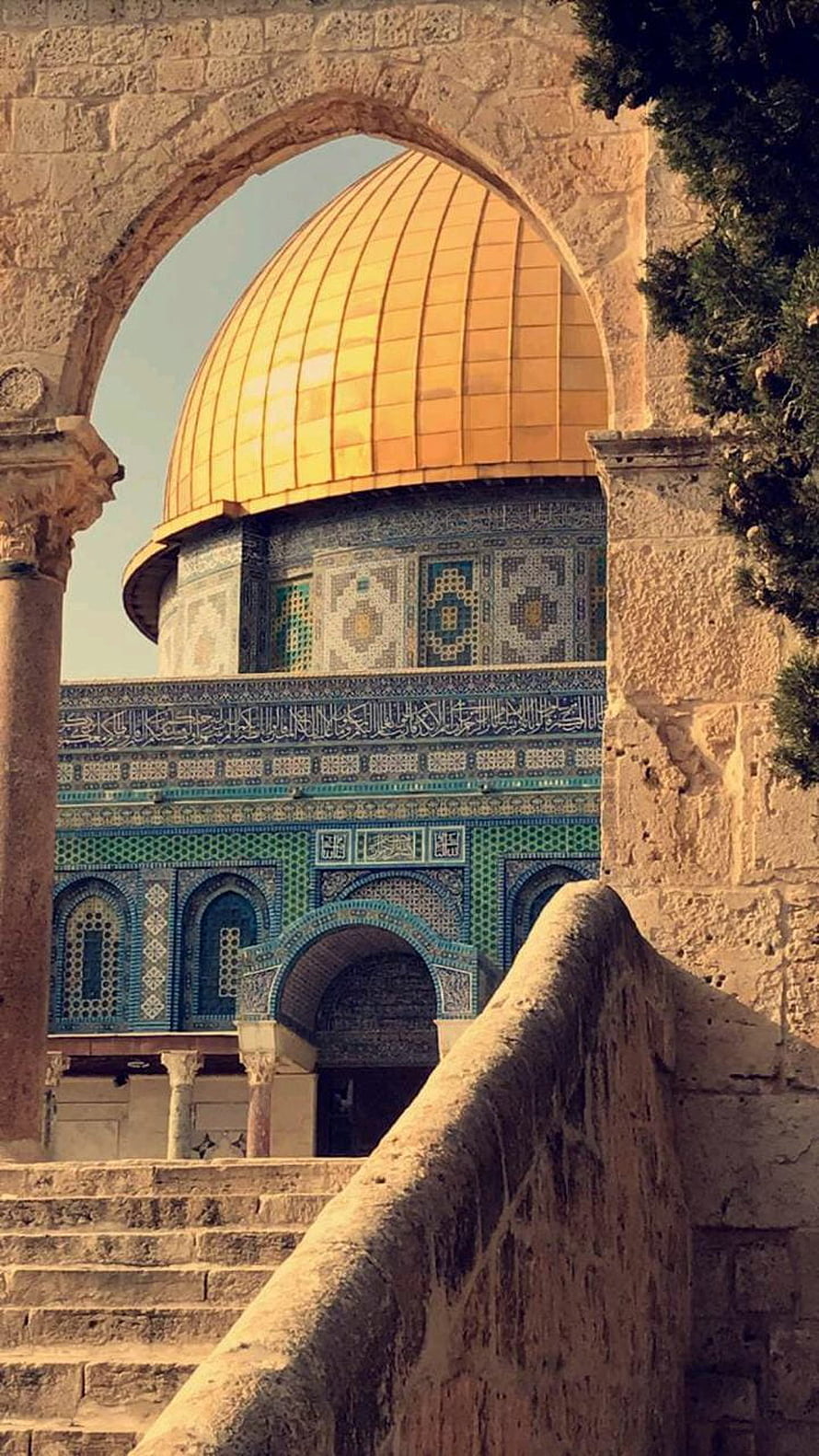 Dome of the Rock in Jerusalem framed by a historic stone archway HD phone wallpaper