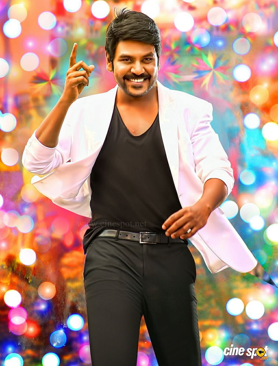 Raghava Lawrence in Shivalinga: White Blazer and Black Outfit Against Vibrant Bokeh Background HD phone wallpaper