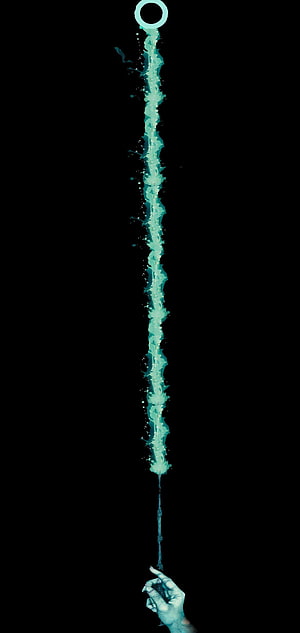 Glowing Cyan Liquid Stream Flowing from Ring to Hand on Black Background HD phone wallpaper