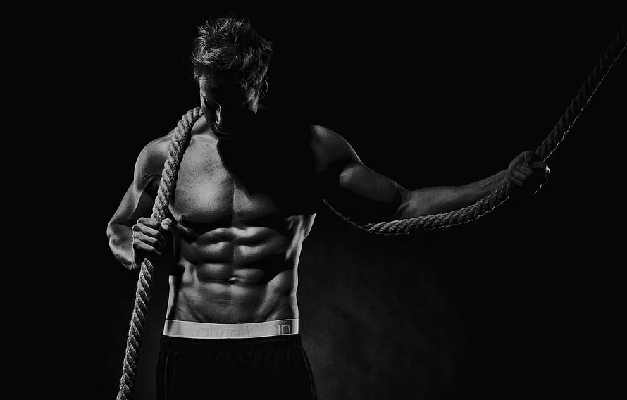 Black and White Portrait of a Muscular Man Pulling a Rope in a Dark Gym, pose, black & white, rope, the cable, muscle, muscle, black and white, press, workout, workout, bodybuilder, abs, bodybuilder, Crossfit , section мужчины, black gym HD wallpaper