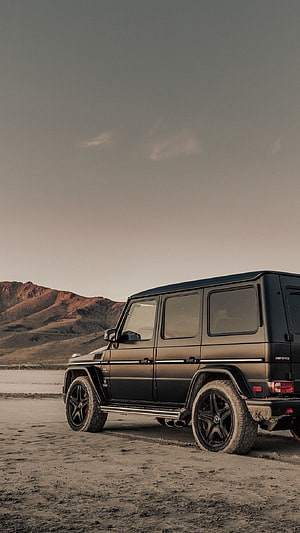 Matte Black Mercedes-AMG G-Class SUV Parked in Desert Landscape HD phone wallpaper