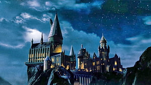 Hogwarts Castle at Night Under a Starry Sky HD wallpaper
