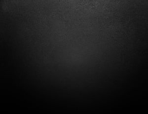 Dark Charcoal Gradient Texture with Subtle Vignette and Matte Finish HD wallpaper