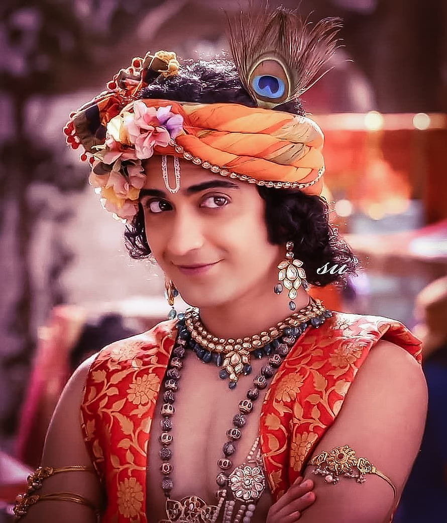 Sumedh Mudgalkar in ornate traditional Indian costume with peacock feather turban and floral headpiece HD phone wallpaper
