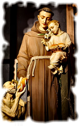 Saint Anthony of Padua Statue Holding Child and Bread in Religious Sculpture HD phone wallpaper