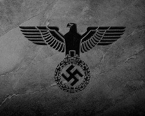Nazi Eagle and Swastika Emblem on Cracked Concrete Wall HD wallpaper