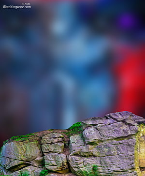 Mossy Rock Formation with Vibrant Bokeh Background and Purple Tones HD phone wallpaper