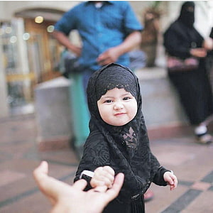 Cute Muslim Baby Girl in Black Hijab Holding Hand HD phone wallpaper