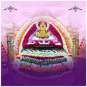 Khatu Shyam Ji Temple Altar with Vibrant Floral Rangoli and Ornate Golden Pillars HD phone wallpaper