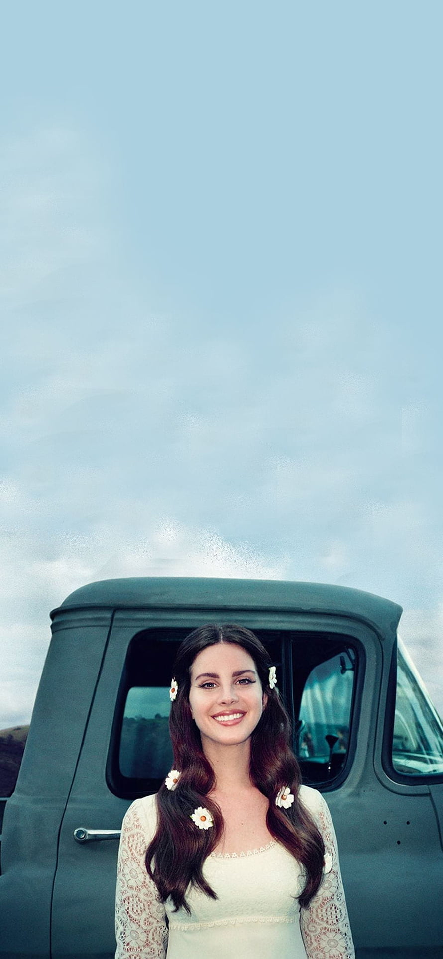 Lana Del Rey in a vintage car with daisy hair accessories and a lace top HD phone wallpaper
