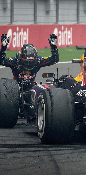 Sebastian Vettel Celebrates Victory in Red Bull Racing Formula One Car on Wet Track HD phone wallpaper