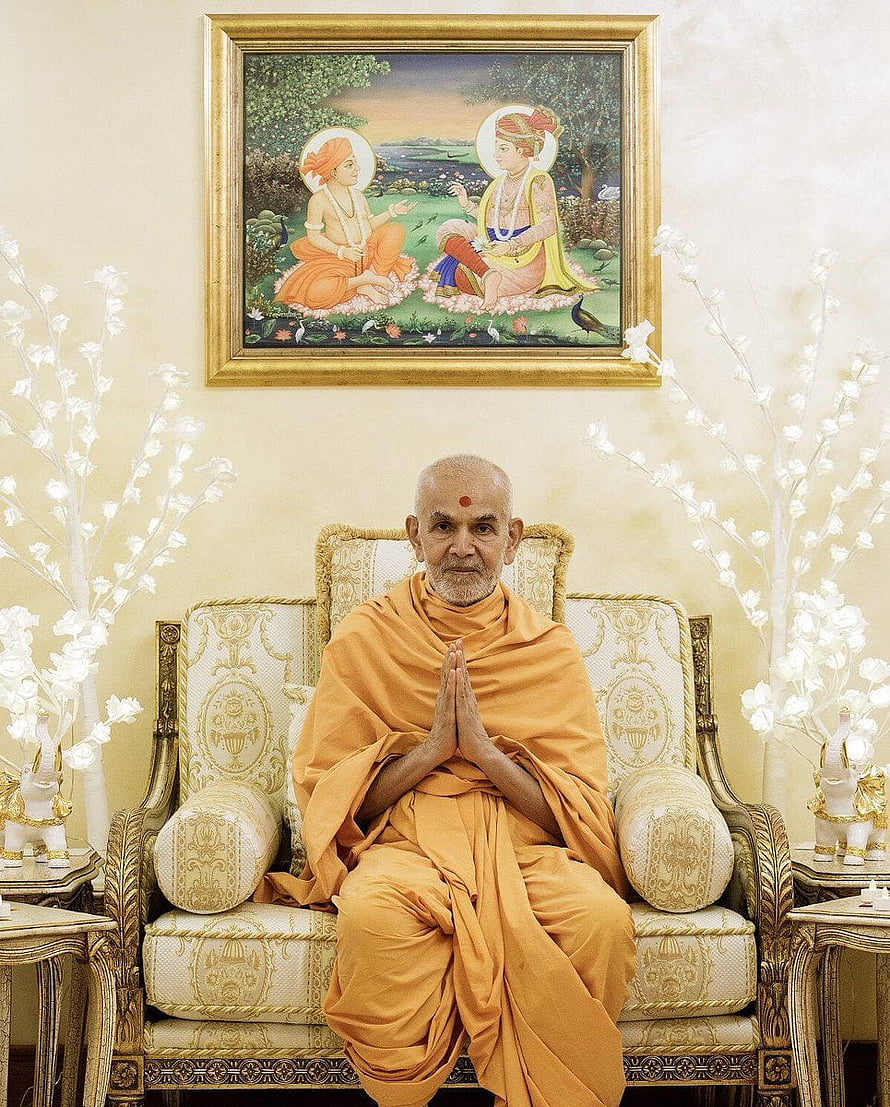 Mahant Swami Maharaj in Orange Saffron Robes Seated in Ornate Chair with Hands in Prayer HD phone wallpaper
