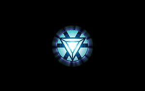 Glowing Arc Reactor Emblem on Black Background HD wallpaper
