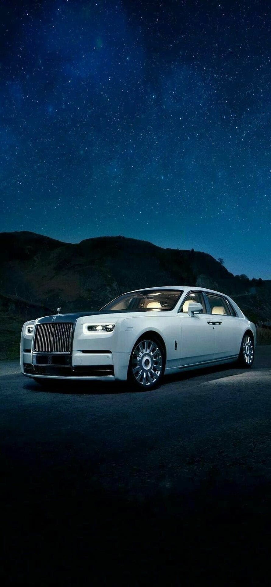 White Rolls-Royce Ghost Luxury Sedan Parked Under a Starry Night Sky HD phone wallpaper