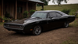 Black 1970 Dodge Charger R/T Parked in a Rustic Countryside Setting HD wallpaper