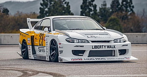 Liberty Walk Nissan Silvia S15 Race Car with Widebody Kit on Track HD wallpaper