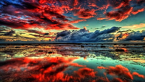 Dramatic Red and Blue Sunset Sky Reflected in Shallow Coastal Waters HD wallpaper