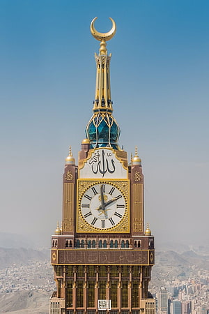 Majestic Abraj Al Bait Clock Tower in Mecca with Golden Crescent and Calligraphy HD phone wallpaper