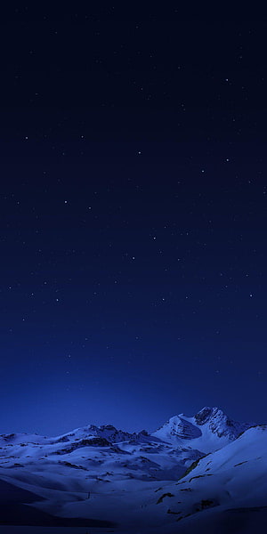 Snow-Capped Mountain Peaks Under a Deep Blue Starry Night Sky HD phone wallpaper