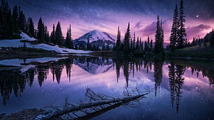Starry Night Sky Over Snow-Capped Mountain Reflected in a Calm Alpine Lake HD wallpaper