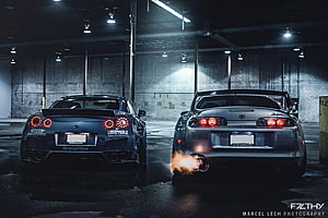 Nissan GT-R and Toyota Supra Rear View in Dark Garage with Exhaust Flames HD wallpaper