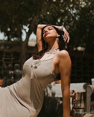 Meenakshi Chaudhary in Elegant Beige Dress with Traditional Jewelry HD phone wallpaper