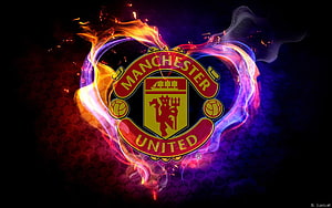Manchester United Club Crest Enveloped in Vibrant Neon Flames and Smoke HD wallpaper