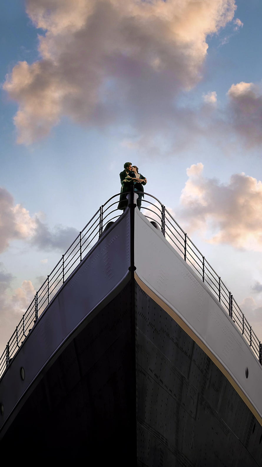 Titanic Movie Scene: Couple Embracing on the Bow of the Ship at Sunset HD phone wallpaper