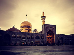 Imam Reza Shrine in Mashhad with Golden Dome and Minaret at Dusk HD wallpaper